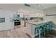 Modern kitchen features stainless steel appliances, granite countertops, and a breakfast bar at 400 Island Way # 1709, Clearwater Beach, FL 33767