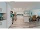 Modern kitchen features stainless steel appliances, granite countertops, and a breakfast bar at 400 Island Way # 1709, Clearwater Beach, FL 33767