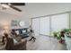 Cozy living room with comfortable seating, modern window treatments, and tranquil water view at 400 Island Way # 1709, Clearwater Beach, FL 33767