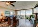 Beautifully decorated living room with waterfront views, sliding glass doors, and hardwood floors at 400 Island Way # 1709, Clearwater Beach, FL 33767