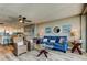Stylish living room featuring hardwood floors, a comfortable sofa, and an open view of the kitchen at 400 Island Way # 1709, Clearwater Beach, FL 33767