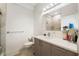 Modern bathroom featuring a sleek vanity, ample counter space, a large mirror, and a glass-enclosed shower at 4108 N Thatcher, Tampa, FL 33614