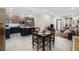 Modern kitchen and dining area featuring a stylish island, stainless steel appliances, and ample counter space at 4108 N Thatcher, Tampa, FL 33614