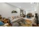 Bright living room featuring a comfortable sofa, stylish rug, and decorative shelf, perfect for relaxing at 4108 N Thatcher, Tampa, FL 33614