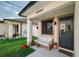 Inviting porch with a cozy wicker sofa, plants, and stylish details, creating a welcoming entrance at 4108 N Thatcher, Tampa, FL 33614