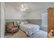 Bedroom with large window, carpet, and chair at 412 Henderson Ave, Seffner, FL 33584