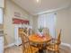 Cozy dining area features a round table, wood chairs, and ample natural light at 412 Henderson Ave, Seffner, FL 33584