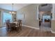 Traditional dining room features a long table, wood chairs, and a chandelier at 412 Henderson Ave, Seffner, FL 33584