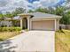Lovely home featuring a two-car garage and a neatly maintained front yard at 412 Henderson Ave, Seffner, FL 33584