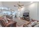 Open concept living room features hardwood floors, ceiling fan, and neutral walls at 412 Henderson Ave, Seffner, FL 33584