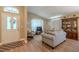 Comfortable living room showcases an open floorplan, neutral paint, and lots of seating at 412 Henderson Ave, Seffner, FL 33584