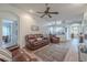 Spacious living room features hardwood floors and ceiling fan at 412 Henderson Ave, Seffner, FL 33584
