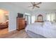 Bedroom featuring hardwood floors, natural light, and a ceiling fan at 412 Henderson Ave, Seffner, FL 33584
