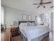 Spacious main bedroom with hardwood floors and a ceiling fan at 412 Henderson Ave, Seffner, FL 33584