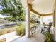 Welcoming porch featuring rocking chairs and well-maintained landscaping at 412 Henderson Ave, Seffner, FL 33584