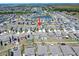 Aerial view of a neighborhood with a lake at 4533 Eternal Prince Dr, Sun City Center, FL 33573