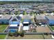 Aerial view of a neighborhood with homes and a community pool at 4533 Eternal Prince Dr, Sun City Center, FL 33573