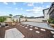 Backyard with patio, lush landscaping, a fenced perimeter, and green space at 4533 Eternal Prince Dr, Sun City Center, FL 33573