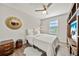 Stylish bedroom with a comfortable bed, unique decor, and wood flooring creates a relaxing retreat at 4533 Eternal Prince Dr, Sun City Center, FL 33573