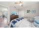 Relaxing bedroom with a comfortable bed, wood flooring, and easy access to the other parts of the house at 4533 Eternal Prince Dr, Sun City Center, FL 33573
