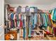 Walk-in closet with shelving and lots of clothes, shoes, and storage containers at 4533 Eternal Prince Dr, Sun City Center, FL 33573