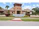Cypress Creek Community sign and clubhouse entrance with beautiful landscaping at 4533 Eternal Prince Dr, Sun City Center, FL 33573