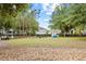 Community dog park with picnic table and agility equipment at 4533 Eternal Prince Dr, Sun City Center, FL 33573