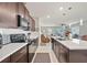 Modern kitchen with stainless steel appliances, dark cabinets, and a large central island at 4533 Eternal Prince Dr, Sun City Center, FL 33573