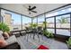 Enclosed patio with wicker furniture, plants, ceiling fan and neutral rug at 4533 Eternal Prince Dr, Sun City Center, FL 33573