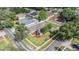 Aerial view of a home with manicured lawns, mature trees, and a desirable corner lot location at 4708 Ranch Grove Ct, Valrico, FL 33596