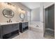 Beautiful bathroom featuring dual vanities, decorative tile floors, and a separate tub and shower at 4708 Ranch Grove Ct, Valrico, FL 33596