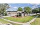 Well-maintained single-Gathering home with lush landscaping and a two-car garage in a desirable neighborhood at 4708 Ranch Grove Ct, Valrico, FL 33596