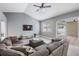 Comfortable living room featuring a spacious layout, modern decor, and sliding door access to the outdoor patio area at 4708 Ranch Grove Ct, Valrico, FL 33596