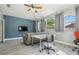 Cozy living room with a large window, a comfy sofa, and a modern desk for work or study at 4708 Ranch Grove Ct, Valrico, FL 33596