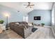 Bright living room boasting vaulted ceilings, modern furnishings, and a seamless design, providing an ideal space for relaxation at 4708 Ranch Grove Ct, Valrico, FL 33596