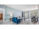 Open concept living and dining area with wood-look tile flooring at 4708 Ranch Grove Ct, Valrico, FL 33596