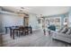 Spacious living area with dining table and sliding door access to the screened lanai at 4708 Ranch Grove Ct, Valrico, FL 33596