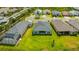 Aerial view of a house with a beautiful backyard and patio in a residential community at 4831 Rosatti Rd, Wesley Chapel, FL 33543