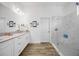 Bright bathroom with double vanity, walk-in shower, and tile floors at 4831 Rosatti Rd, Wesley Chapel, FL 33543