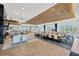 Open-concept clubhouse featuring dining tables, seating areas, and a kitchen at 4831 Rosatti Rd, Wesley Chapel, FL 33543