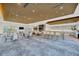 Expansive lounge and kitchen with meeting room with golf course views at 4831 Rosatti Rd, Wesley Chapel, FL 33543