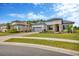 Charming single-story home with well-manicured lawn, stone accents, tile roof, and paver driveway at 4831 Rosatti Rd, Wesley Chapel, FL 33543