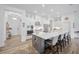 Modern kitchen with a large center island, stainless steel appliances, and white cabinetry at 4831 Rosatti Rd, Wesley Chapel, FL 33543