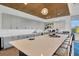 Features an island with seating, modern appliances, and stylish gray cabinets at 4831 Rosatti Rd, Wesley Chapel, FL 33543