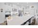 Bright and airy kitchen with large white center island and stainless steel appliances at 4831 Rosatti Rd, Wesley Chapel, FL 33543