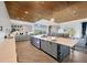 Large island and adjacent eating area overlooks a manicured backyard and golf course at 4831 Rosatti Rd, Wesley Chapel, FL 33543