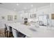 Stunning kitchen featuring a large island with seating and stainless steel appliances at 4831 Rosatti Rd, Wesley Chapel, FL 33543