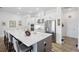 Elegant kitchen with white quartz countertops, stainless steel appliances, and a large island at 4831 Rosatti Rd, Wesley Chapel, FL 33543
