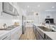 Spacious kitchen featuring white cabinets, stainless steel appliances, and long center island at 4831 Rosatti Rd, Wesley Chapel, FL 33543