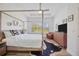 Bright main bedroom boasts a four poster bed, shuttered windows, and a ceiling fan at 4831 Rosatti Rd, Wesley Chapel, FL 33543